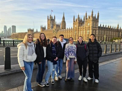 A group of students standing in front of westminster